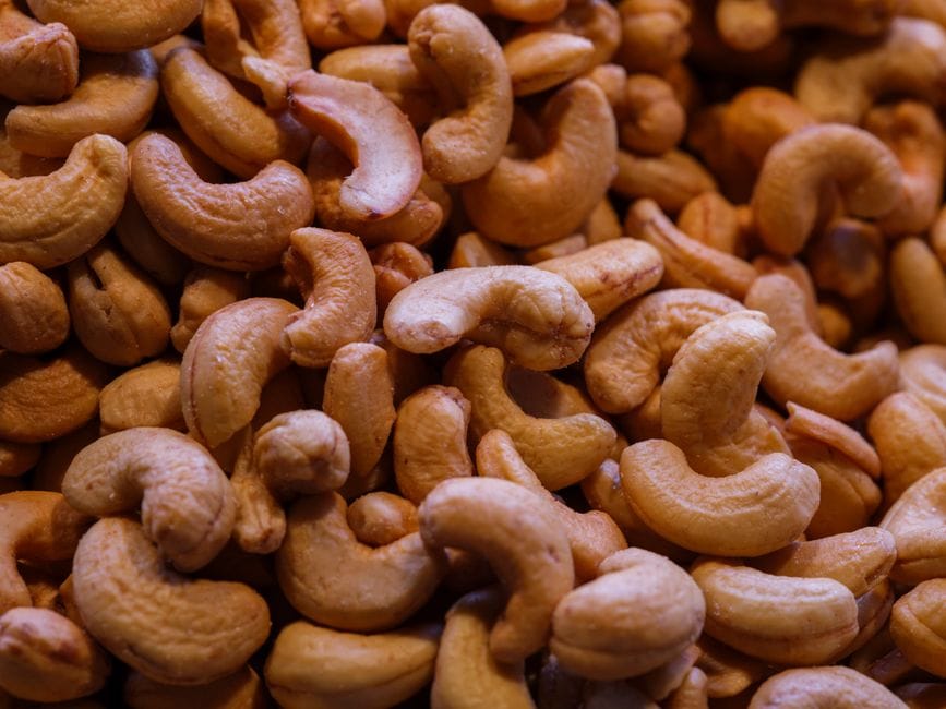 High-quality closeup image of fresh organic cashews, perfect for healthy cooking and snacking.