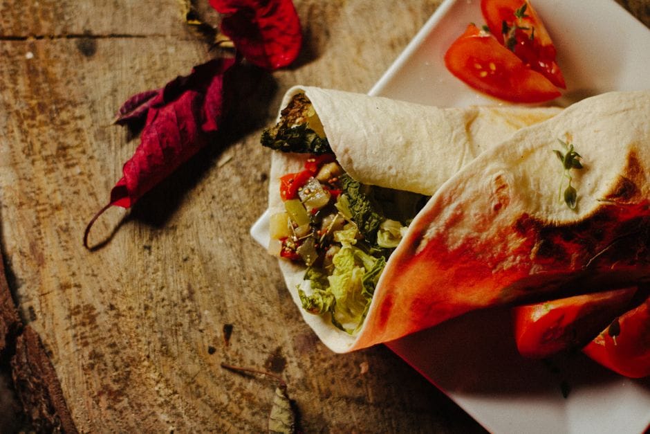 Savor this appetizing vegan wrap filled with fresh vegetables, perfect for healthy eating.