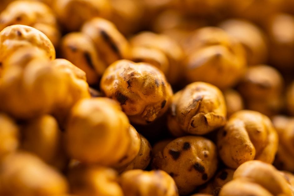 Macro shot of roasted chickpeas showcasing texture and warm hues.