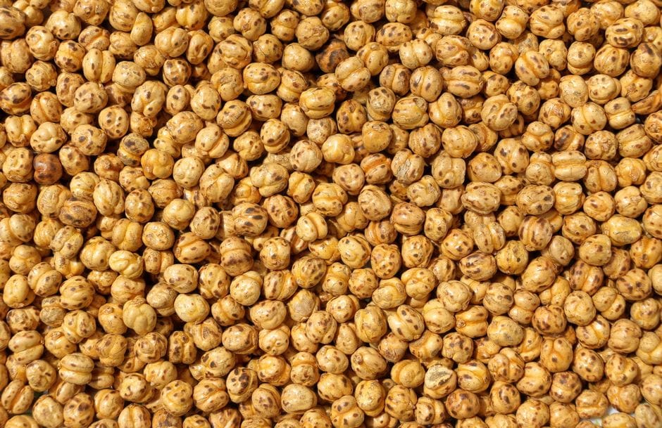 Close-up texture of roasted chickpeas providing a healthy snack background.