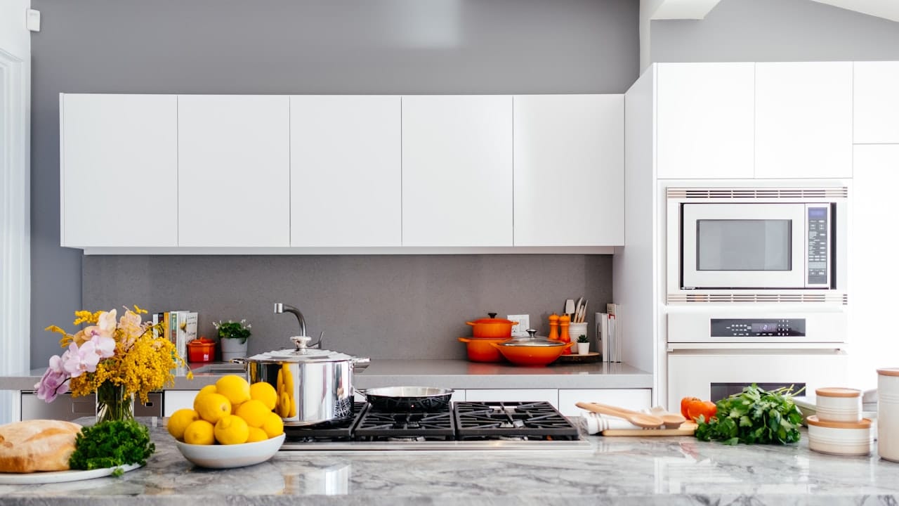 modern white kitchen with marble island