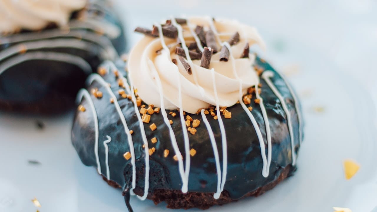 chocolate cake with white icing on top