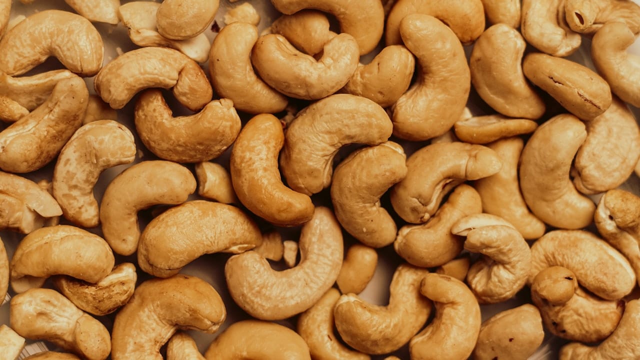 A pile of cashews sitting on top of a table